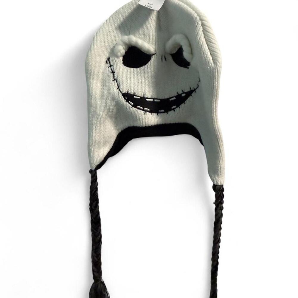 Disney Parks white Jack Skellington beanie with braided ear flaps. NWT